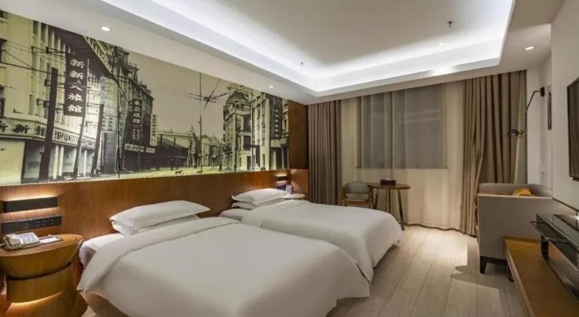 Bed in Jinjiang Metropolo Hotel Shanghai Hongqiao International Exhibition Center Branch