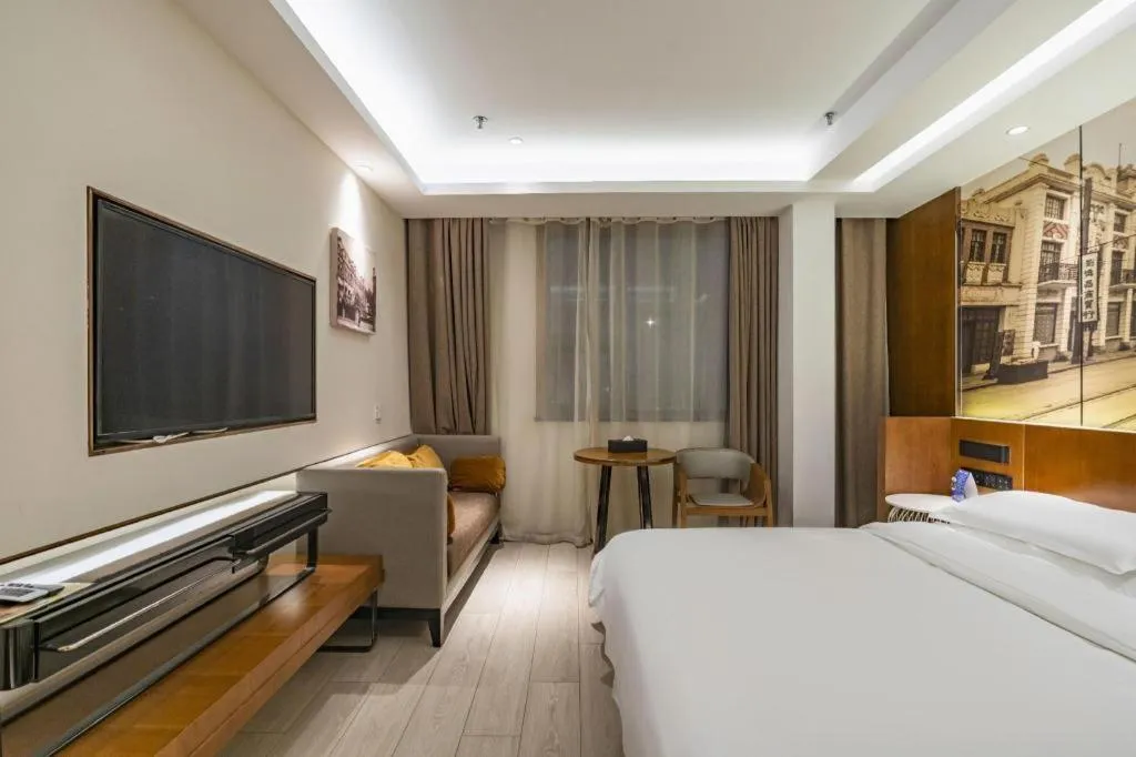 Bed in Jinjiang Metropolo Hotel Shanghai Hongqiao International Exhibition Center Branch