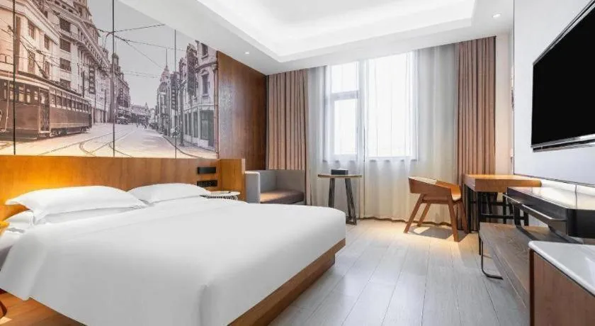 Bed in Jinjiang Metropolo Hotel Shanghai Hongqiao International Exhibition Center Branch