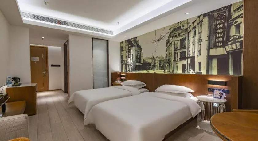 Bed in Jinjiang Metropolo Hotel Shanghai Hongqiao International Exhibition Center Branch