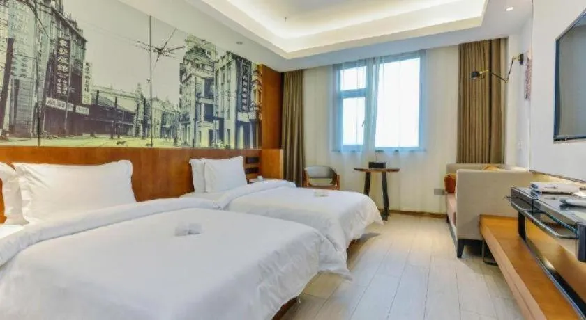 Bed in Jinjiang Metropolo Hotel Shanghai Hongqiao International Exhibition Center Branch