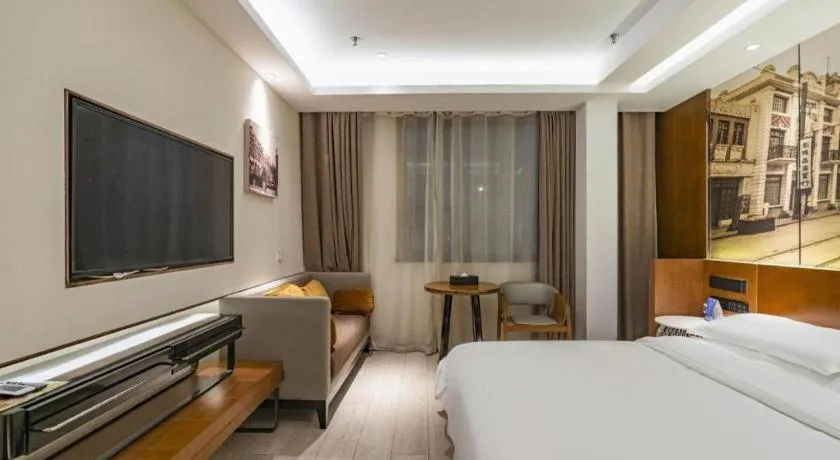 Bed in Jinjiang Metropolo Hotel Shanghai Hongqiao International Exhibition Center Branch