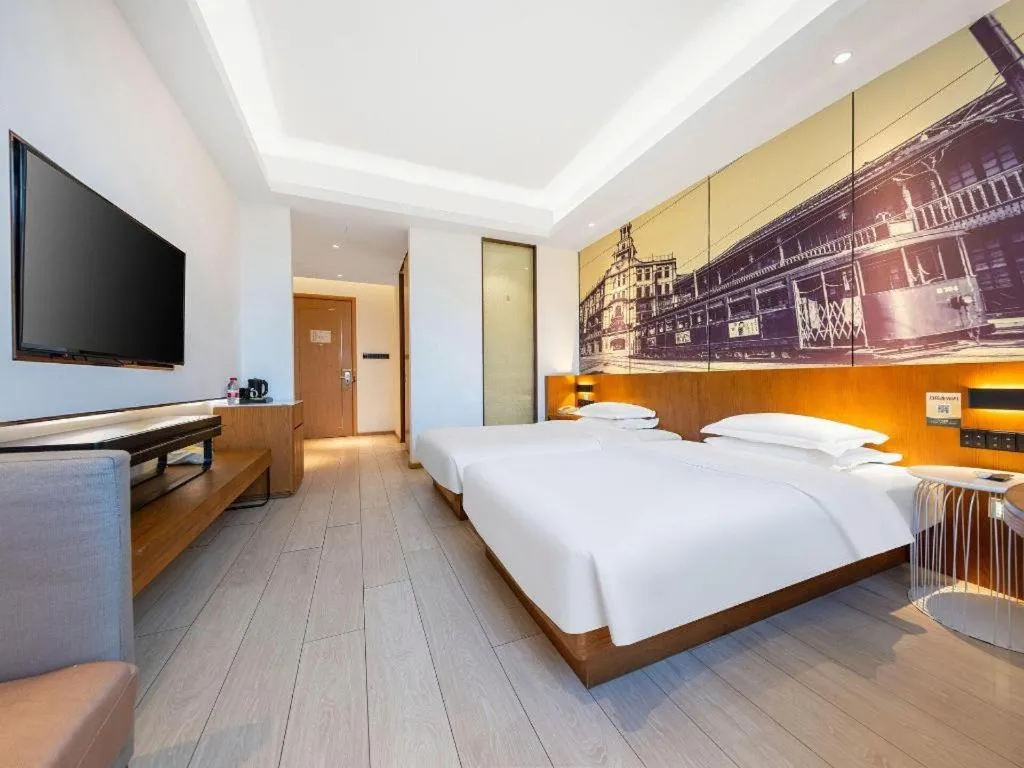Bed in Jinjiang Metropolo Hotel Shanghai Hongqiao International Exhibition Center Branch