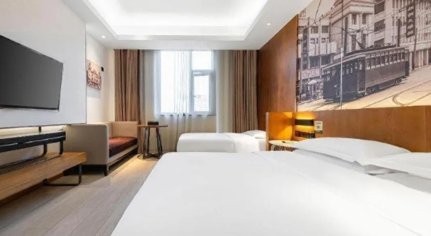 Bed in Jinjiang Metropolo Hotel Shanghai Hongqiao International Exhibition Center Branch