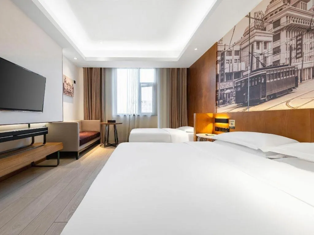 Bed in Jinjiang Metropolo Hotel Shanghai Hongqiao International Exhibition Center Branch