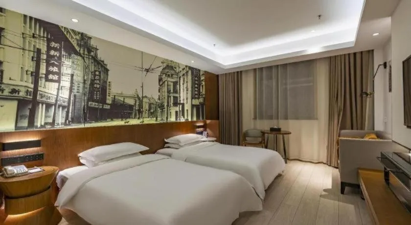Bed in Jinjiang Metropolo Hotel Shanghai Hongqiao International Exhibition Center Branch