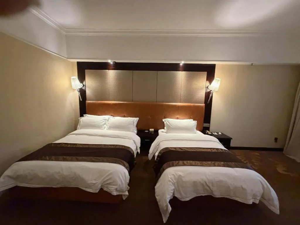 Bed in The Bmc Hotel