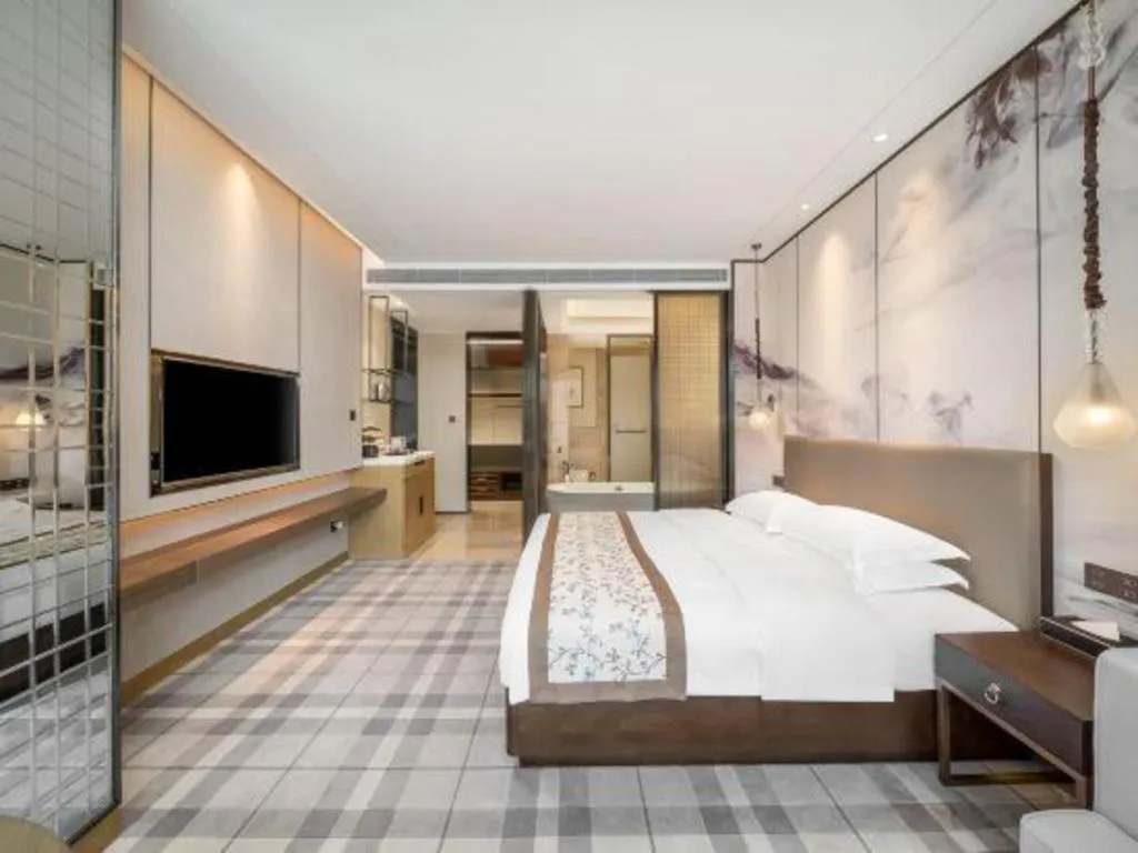 Bed in ZHONG DING HOTEL