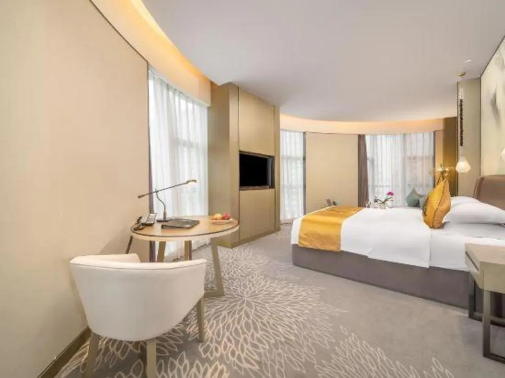 Bed in ZHONG DING HOTEL