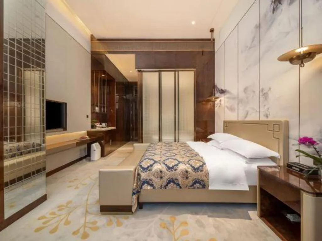 Bed in ZHONG DING HOTEL