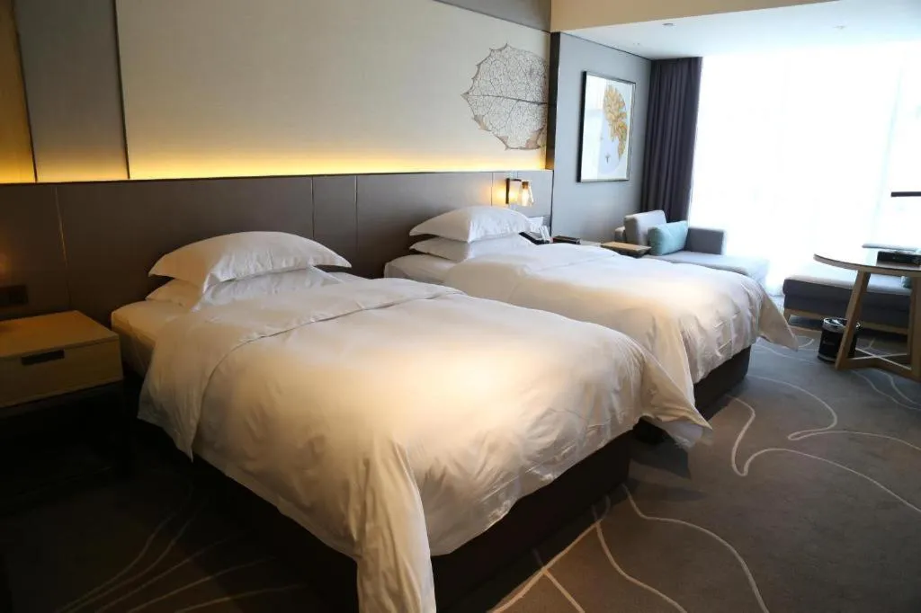 Bed in ZHONG DING HOTEL