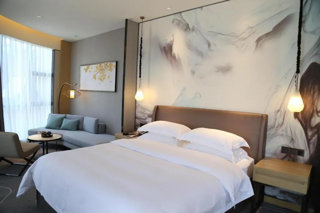 Bed in ZHONG DING HOTEL