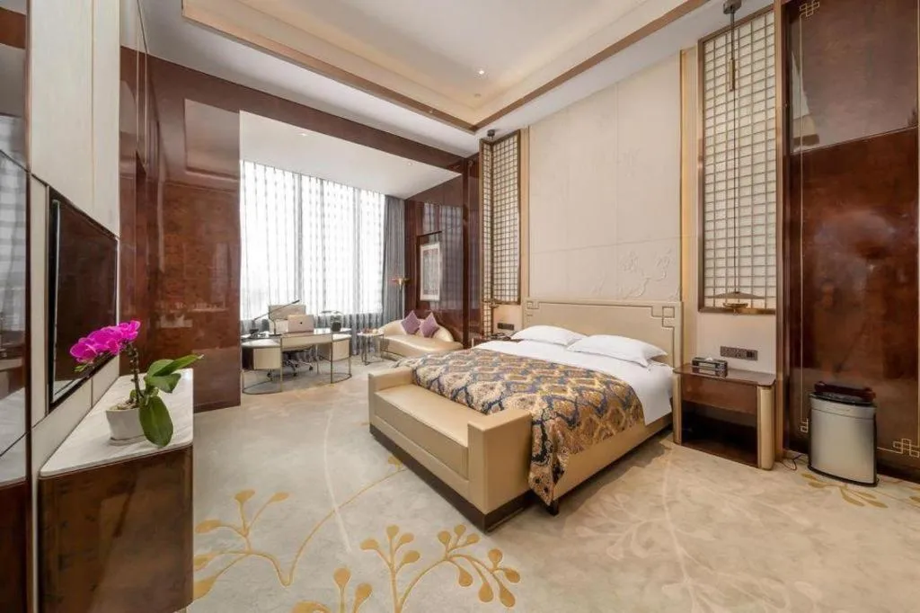 Bed in ZHONG DING HOTEL