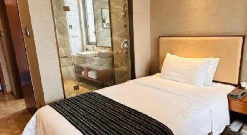 Bed in Ramada Encore by Wyndham Wuhan Caidian