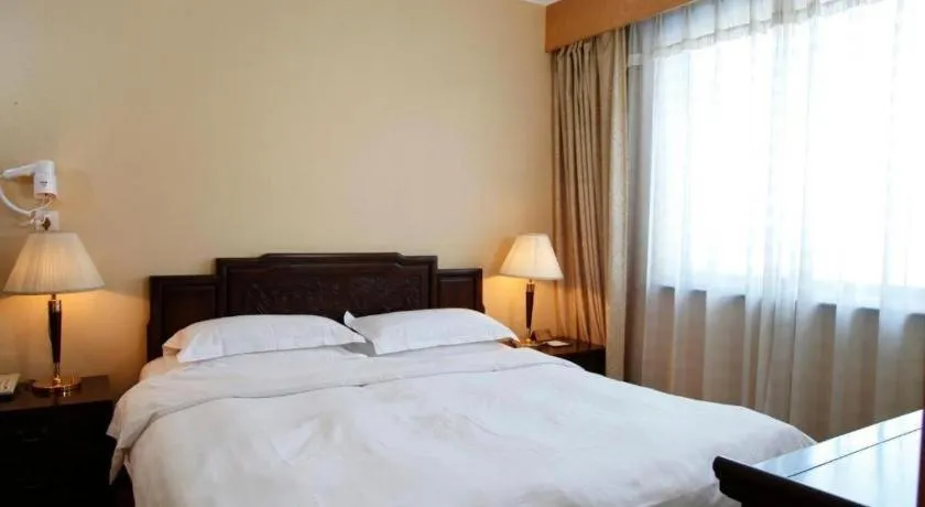 Bed in Hujialou Hot Spring Hotel