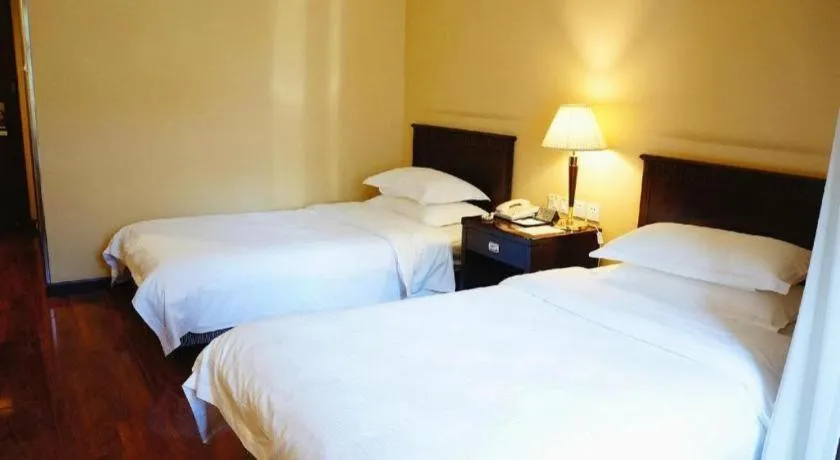 Bed in Hujialou Hot Spring Hotel