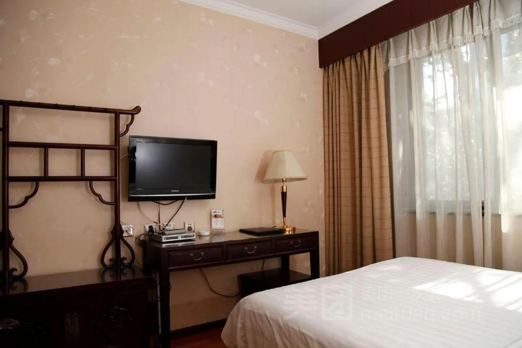 Bed in Hujialou Hot Spring Hotel