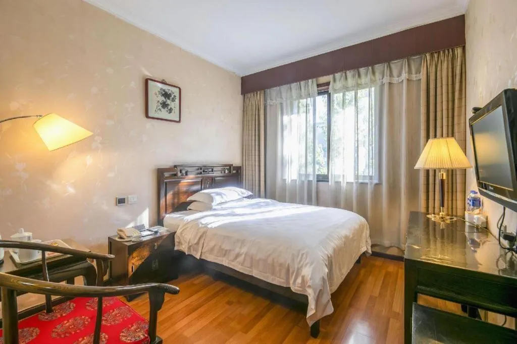 Bed in Hujialou Hot Spring Hotel