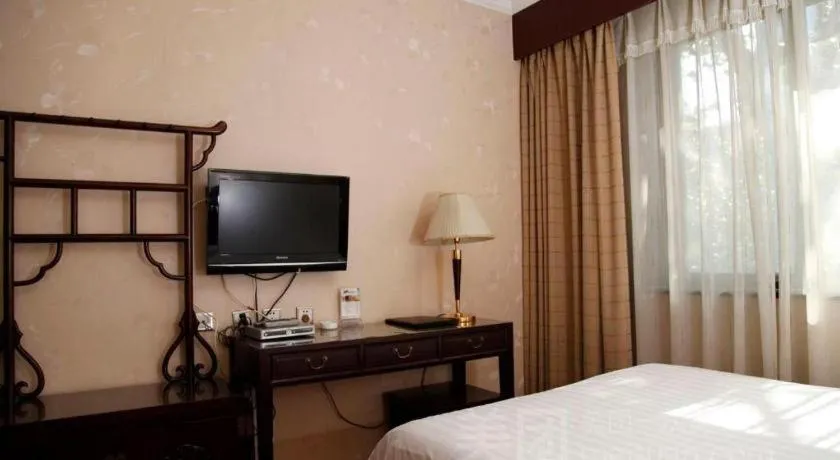 Bed in Hujialou Hot Spring Hotel