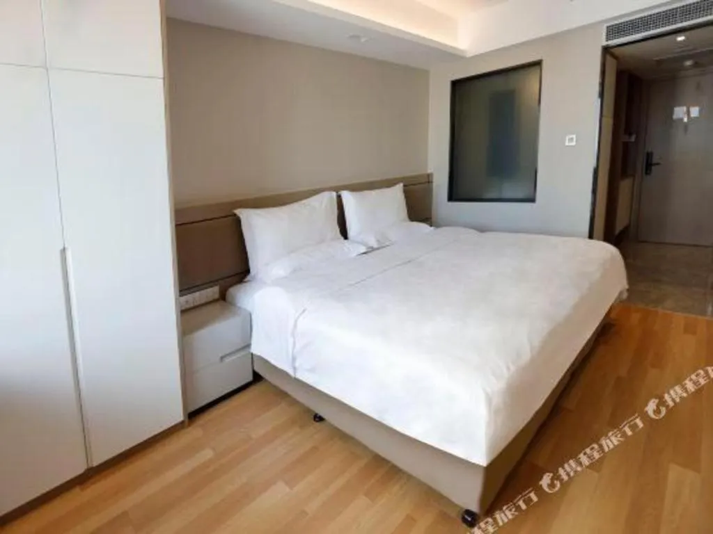 Bed in Hujialou Hot Spring Hotel