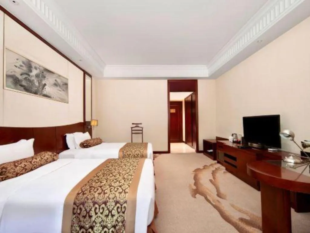 Bed in Longqi Jianguo Hotel Kunshan