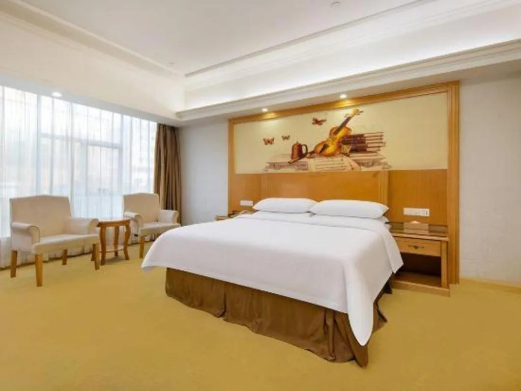 Bed in Vienna Hotel Shenzhen Longgang Baifucheng