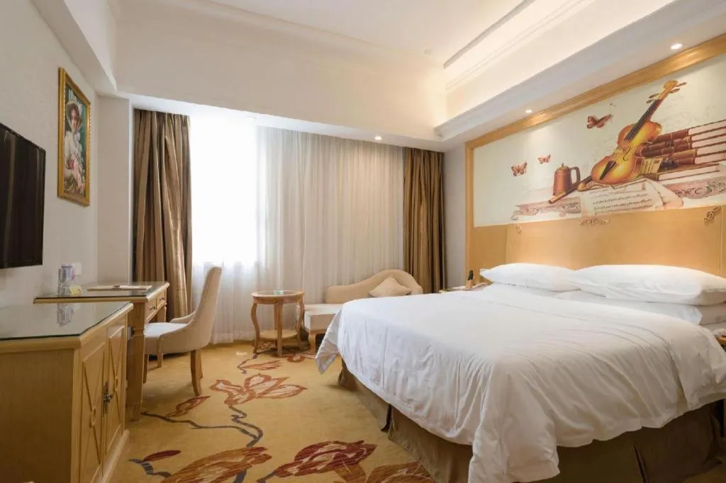 Bed in Vienna Hotel Shenzhen Longgang Baifucheng