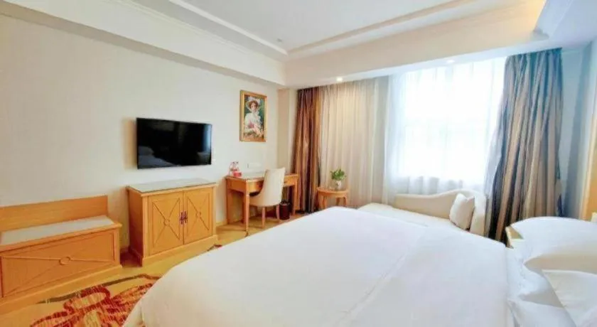 Bed in Vienna Hotel Shenzhen Longgang Baifucheng