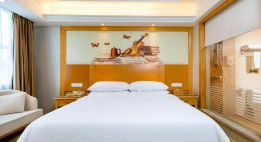 Bed in Vienna Hotel Shenzhen Longgang Baifucheng