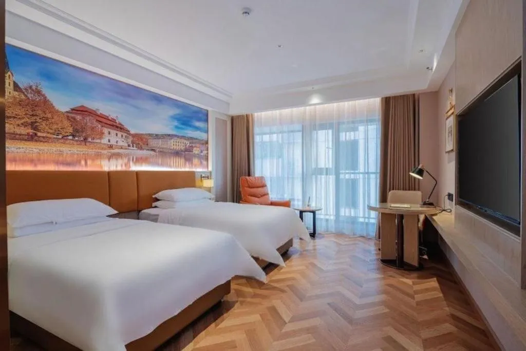Bed in Vienna Hotel Shenzhen Longgang Baifucheng