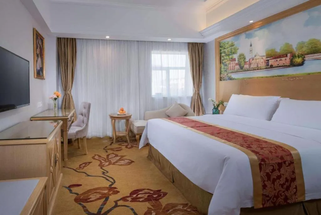 Bed in Vienna Hotel Shenzhen Longgang Baifucheng