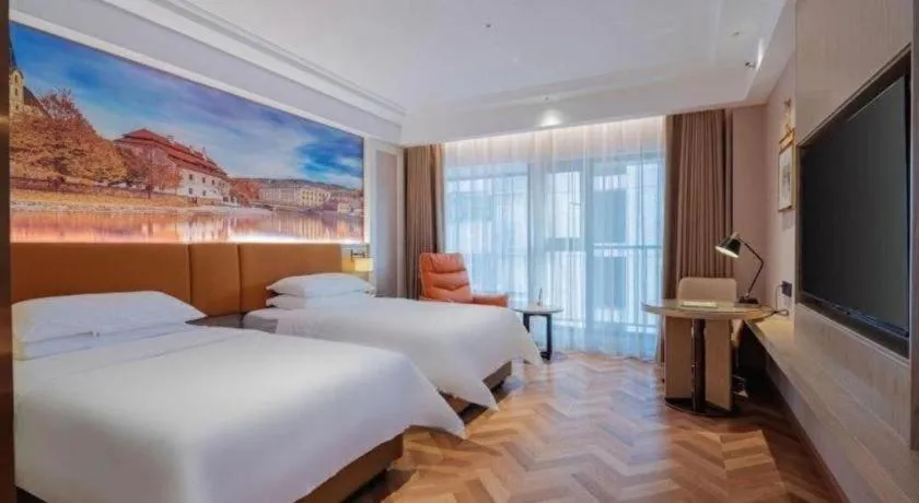Bed in Vienna Hotel Shenzhen Longgang Baifucheng
