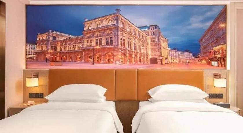 Bed in Vienna Hotel Shenzhen Longgang Baifucheng