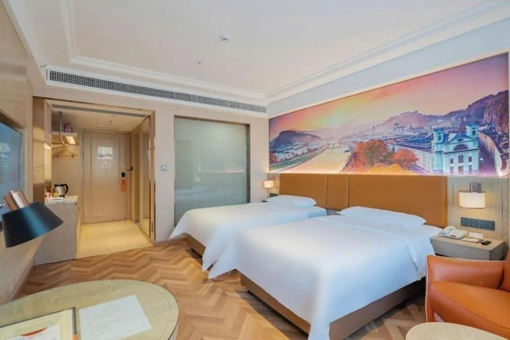 Bed in Vienna Hotel Shenzhen Longgang Baifucheng