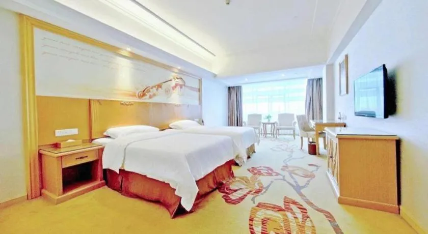 Bed in Vienna Hotel Shenzhen Longgang Baifucheng