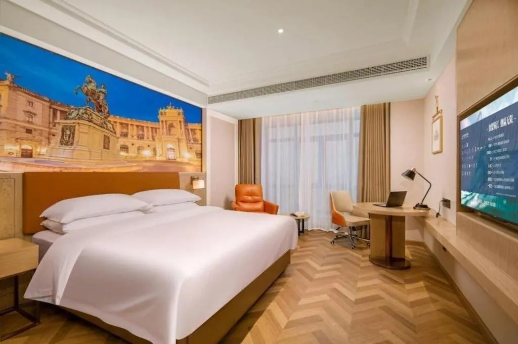 Bed in Vienna Hotel Shenzhen Longgang Baifucheng