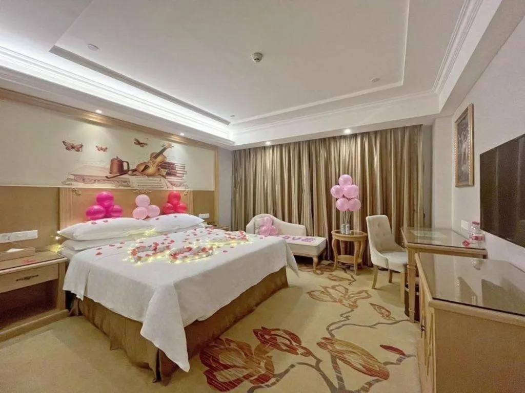 Bed in Vienna Hotel Shenzhen Longgang Baifucheng