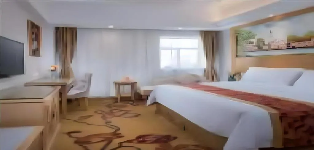 Bed in Vienna Hotel Shenzhen Longgang Baifucheng