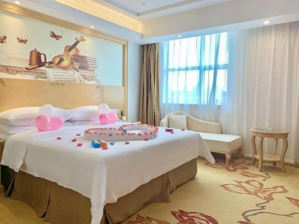 Bed in Vienna Hotel Shenzhen Longgang Baifucheng