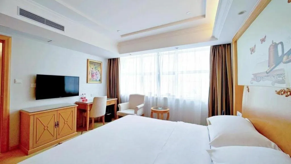 Bed in Vienna Hotel Shenzhen Longgang Baifucheng