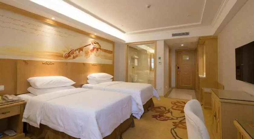 Bed in Vienna Hotel Shenzhen Longgang Baifucheng