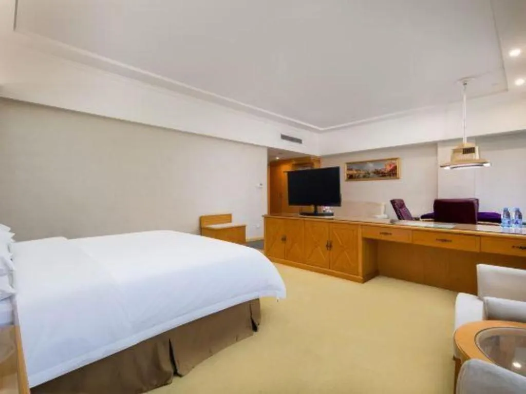 Bed in Vienna Hotel Shenzhen Longgang Baifucheng