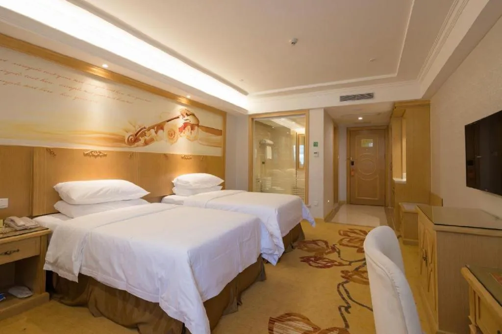 Bed in Vienna Hotel Shenzhen Longgang Baifucheng