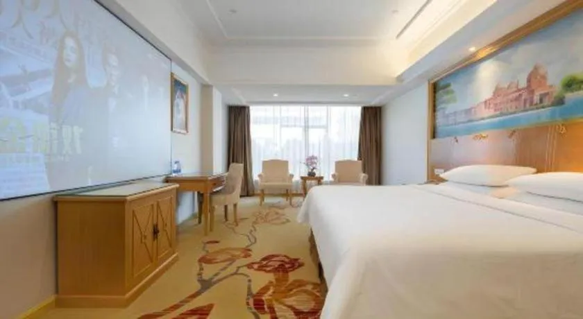 Bed in Vienna Hotel Shenzhen Longgang Baifucheng