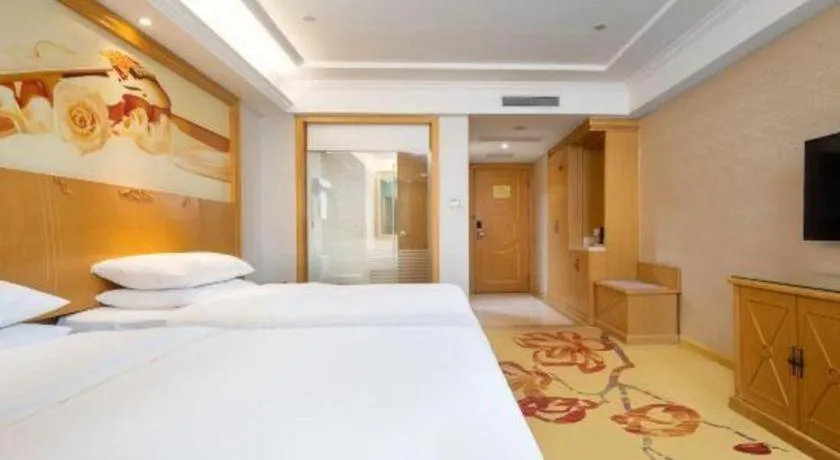 Bed in Vienna Hotel Shenzhen Longgang Baifucheng