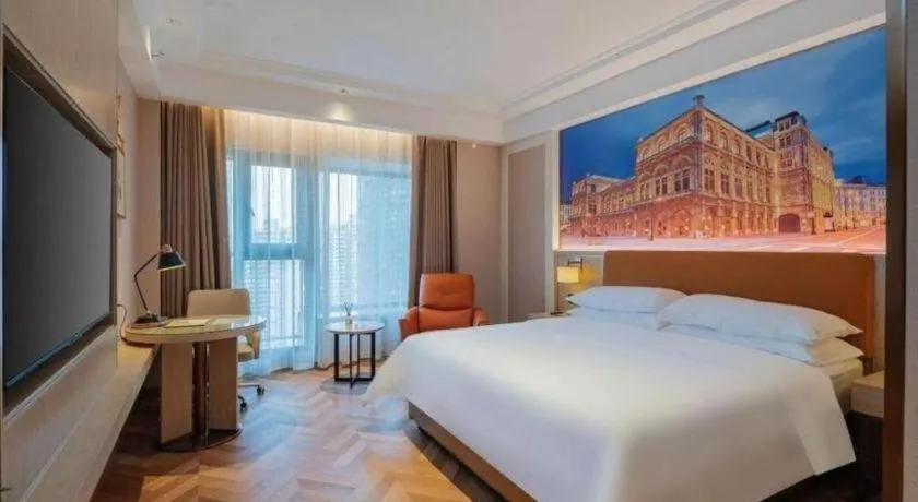 Bed in Vienna Hotel Shenzhen Longgang Baifucheng