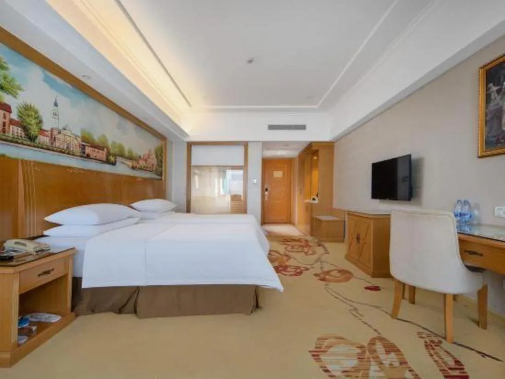 Bed in Vienna Hotel Shenzhen Longgang Baifucheng