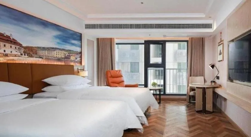 Bed in Vienna Hotel Shenzhen Longgang Baifucheng