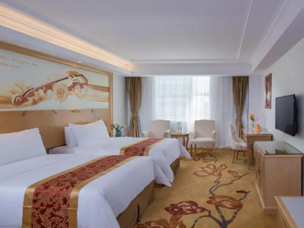 Bed in Vienna Hotel Shenzhen Longgang Baifucheng