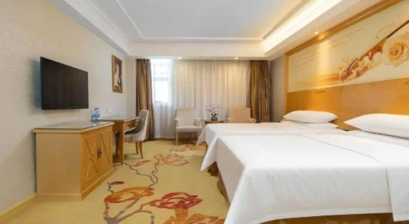Bed in Vienna Hotel Shenzhen Longgang Baifucheng